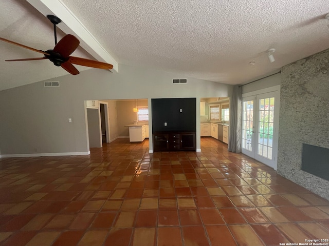 14102 Anabella, San Antonio, TX 78247 - unfurnished living room with a textured ceiling, healthy amount of natural light, tile patterned flooring, and a ceiling fan