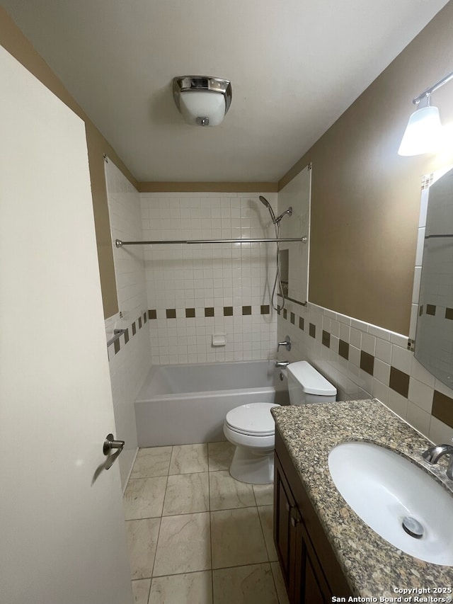 14102 Anabella, San Antonio, TX 78247 - bathroom with toilet, vanity, tile walls, and tub / shower combination