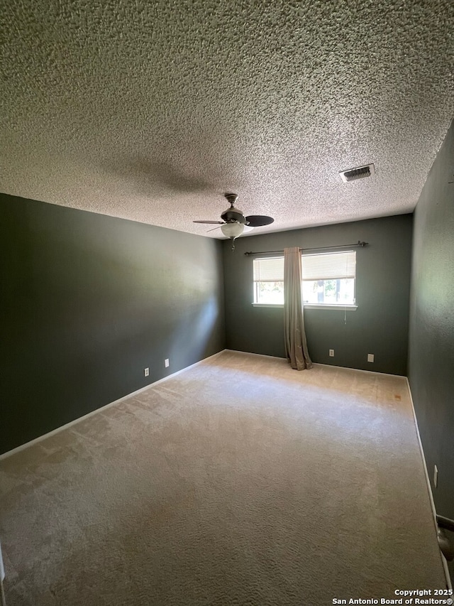 14102 Anabella, San Antonio, TX 78247 - spare room featuring a ceiling fan, carpet flooring, and a textured ceiling