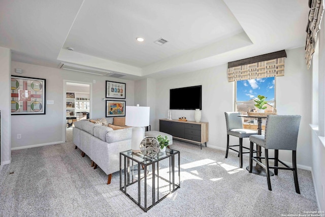 11212 Schmidt Ln, Converse, TX 78109 - carpeted living area with a tray ceiling and baseboards