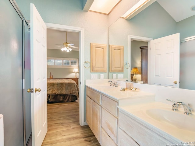 6 Oakwell Farms, San Antonio, TX 78218 - full bath featuring connected bathroom, double vanity, wood finished floors, a ceiling fan, and an enclosed shower