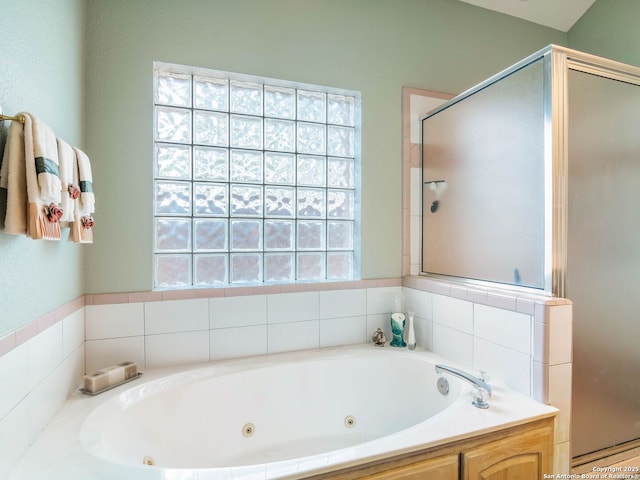 6 Oakwell Farms, San Antonio, TX 78218 - bathroom featuring a stall shower, a whirlpool tub, and plenty of natural light