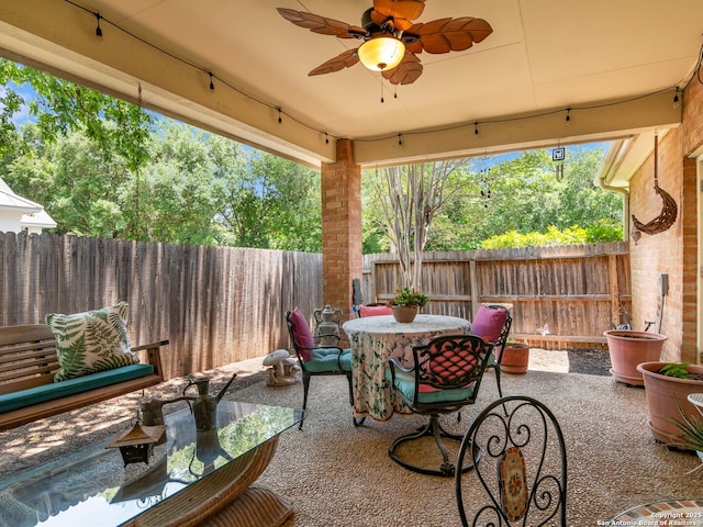 6 Oakwell Farms, San Antonio, TX 78218 - fenced backyard with outdoor dining area, a patio, and a ceiling fan