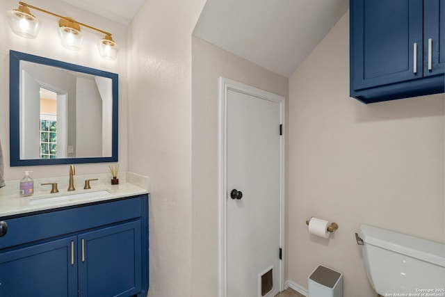 7306 Park W, San Antonio, TX 78250 - half bathroom with vanity, toilet, and vaulted ceiling