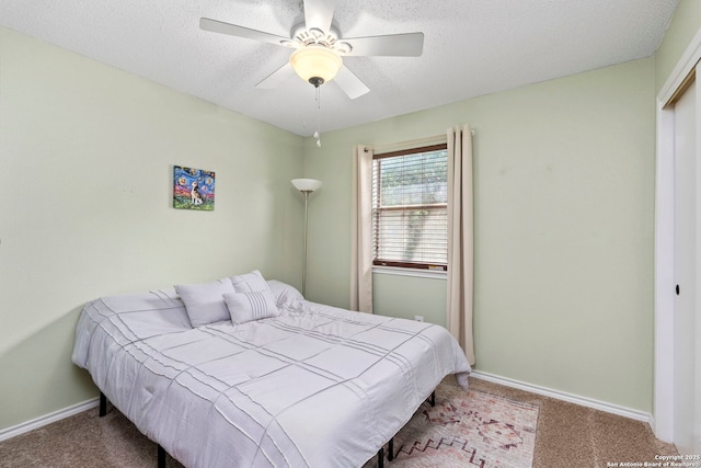 7306 Park W, San Antonio, TX 78250 - carpeted bedroom with a textured ceiling, baseboards, a closet, and ceiling fan
