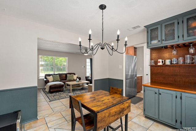 7306 Park W, San Antonio, TX 78250 - dining area featuring a chandelier and light tile patterned floors