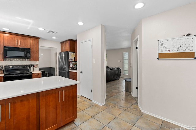 7306 Park W, San Antonio, TX 78250 - kitchen featuring black appliances, light countertops, brown cabinets, baseboards, and recessed lighting