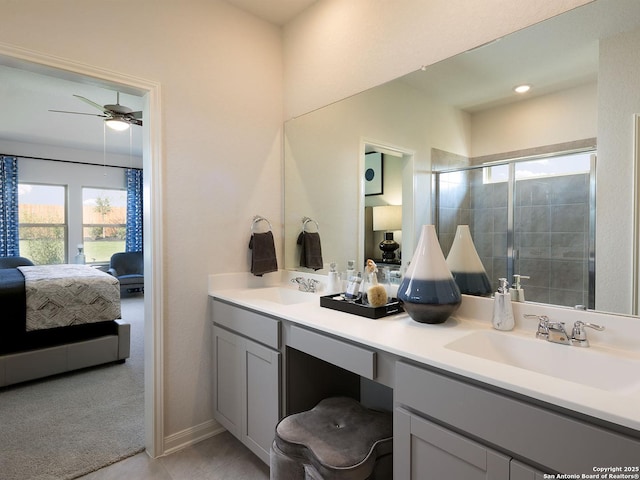 9921 Paladin Rdg, San Antonio, TX 78254 - bathroom with ensuite bath, double vanity, a shower stall, and ceiling fan