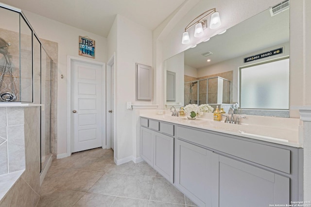 112 La Cima, Boerne, TX 78006 - bathroom featuring double vanity, a stall shower, and tile patterned flooring