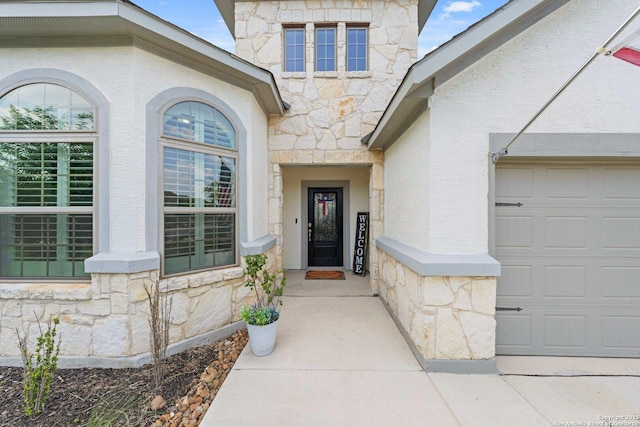 112 La Cima, Boerne, TX 78006 - property entrance featuring stone siding, stucco siding, and a garage
