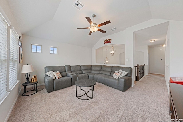 112 La Cima, Boerne, TX 78006 - living area with lofted ceiling, carpet flooring, ceiling fan, baseboards, and a chandelier