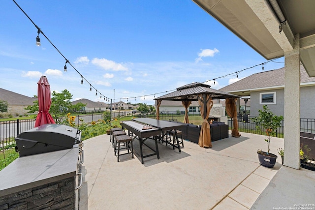 112 La Cima, Boerne, TX 78006 - fenced backyard with a patio, outdoor dining area, a gazebo, outdoor lounge area, and a residential view