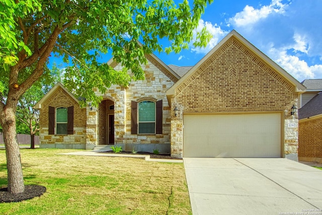 12902 Gypsophila, San Antonio, TX 78253 - view of front of home featuring a garage, stone siding, driveway, and a front lawn