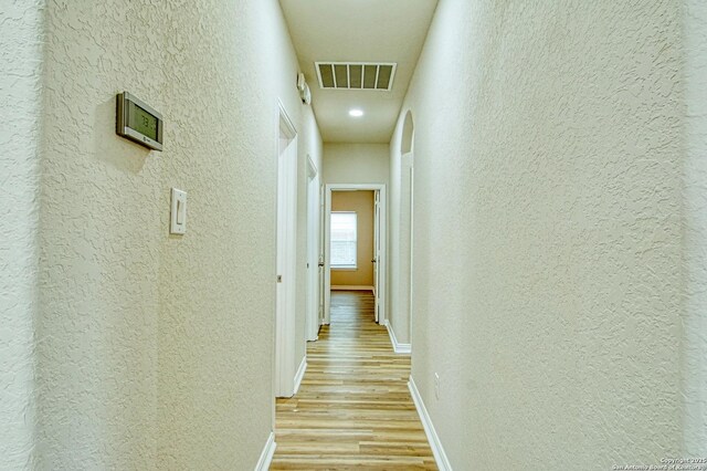 12902 Gypsophila, San Antonio, TX 78253 - hall with a textured wall, light wood-style flooring, and baseboards