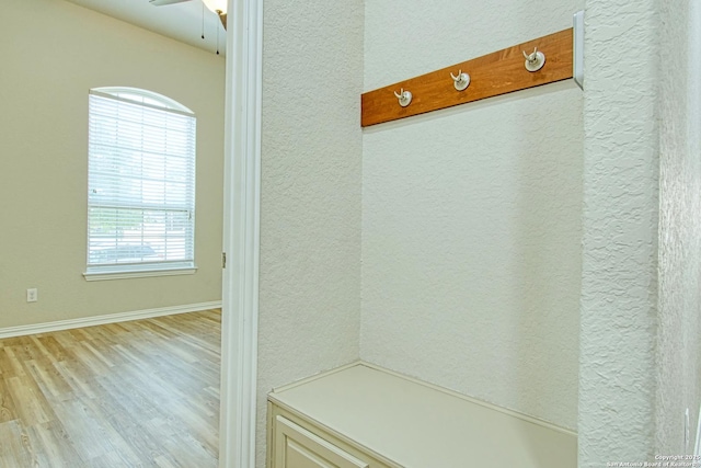 12902 Gypsophila, San Antonio, TX 78253 - mudroom with light wood-type flooring, a textured wall, ceiling fan, and baseboards