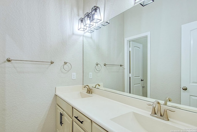 12902 Gypsophila, San Antonio, TX 78253 - full bath featuring a textured wall and double vanity