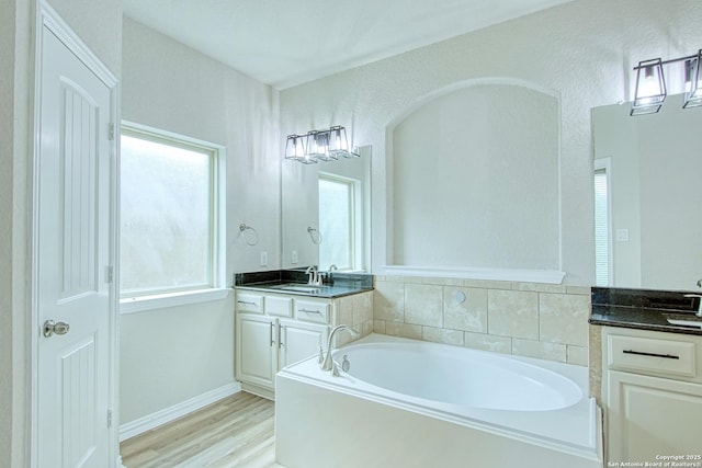 12902 Gypsophila, San Antonio, TX 78253 - full bath with a bath, vanity, and wood finished floors