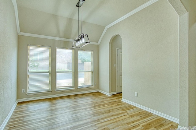12902 Gypsophila, San Antonio, TX 78253 - unfurnished dining area with crown molding, lofted ceiling, a textured wall, healthy amount of natural light, and arched walkways