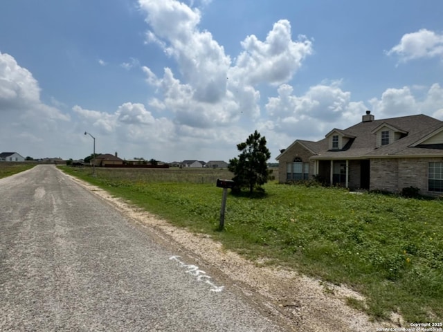 135 Muirfield Ln, Vernia, TX 78121 - view of asphalt street with street lights