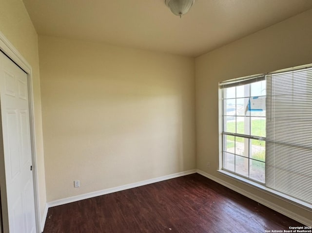 135 Muirfield Ln, Vernia, TX 78121 - unfurnished room featuring dark wood-style flooring and baseboards