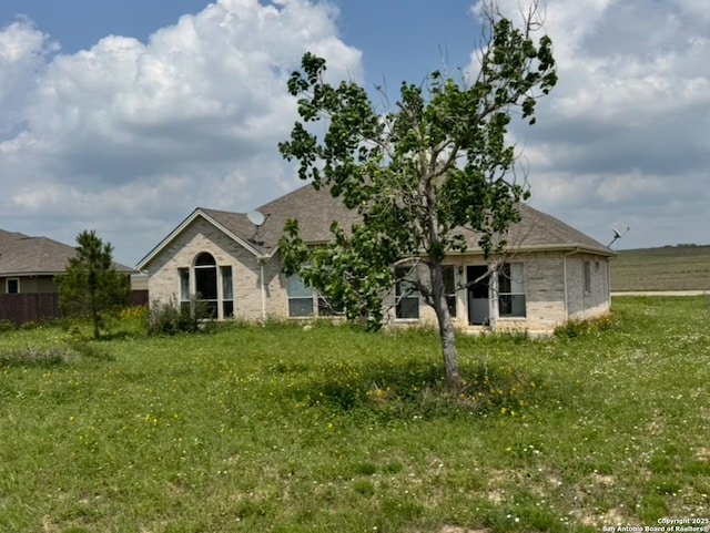 135 Muirfield Ln, Vernia, TX 78121 - back of property featuring brick siding and roof with shingles