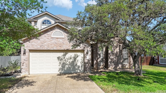17915 Crystal Knl, San Antonio, TX 78258 - view of front of home with concrete driveway, brick siding, and a garage