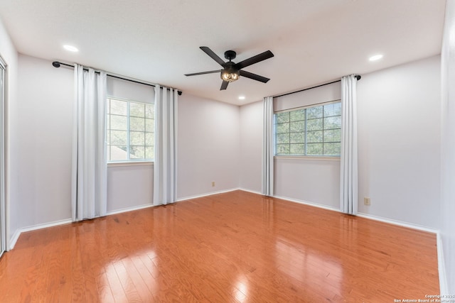 17915 Crystal Knl, San Antonio, TX 78258 - unfurnished room featuring a ceiling fan, healthy amount of natural light, wood finished floors, baseboards, and recessed lighting