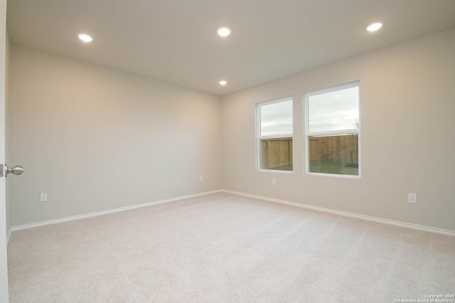 8570 Redhawk Lp, San Antonio, TX 78222 - unfurnished room featuring light colored carpet, recessed lighting, and baseboards