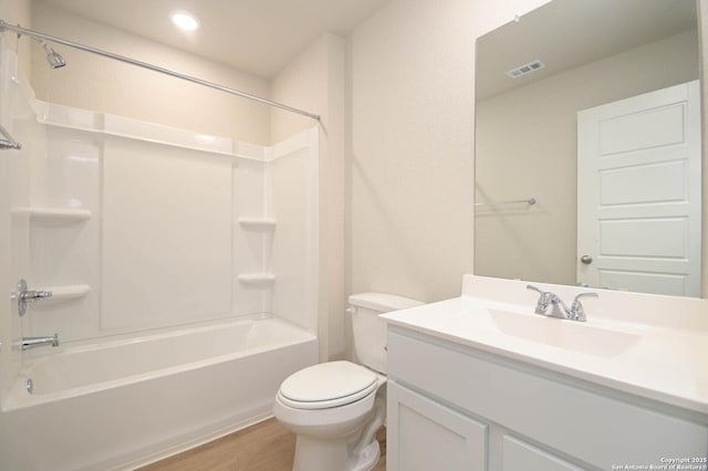 8570 Redhawk Lp, San Antonio, TX 78222 - full bathroom featuring vanity, bathtub / shower combination, toilet, wood finished floors, and recessed lighting