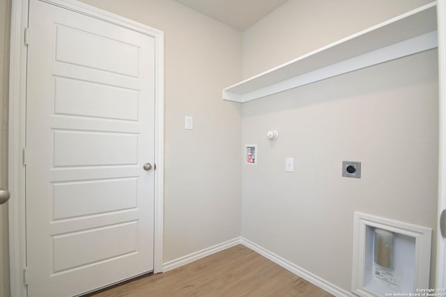8570 Redhawk Lp, San Antonio, TX 78222 - laundry area with hookup for an electric dryer, washer hookup, light wood-type flooring, baseboards, and gas dryer hookup