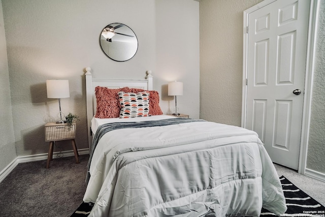 158 Landing Ln, New Braunfels, TX 78130 - bedroom with carpet floors, a textured wall, and baseboards