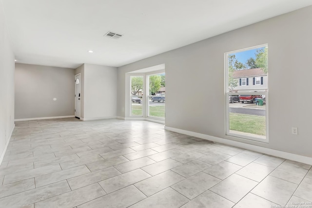 5815 Oak Run, San Antonio, TX 78247 - spare room with plenty of natural light, baseboards, recessed lighting, and light tile patterned floors