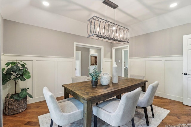 15643 Cloud Top, San Antonio, TX 78248 - dining area with a decorative wall, a chandelier, wainscoting, dark wood-type flooring, and recessed lighting