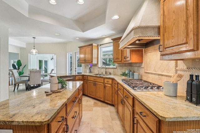 15643 Cloud Top, San Antonio, TX 78248 - kitchen featuring custom exhaust hood, a sink, brown cabinets, recessed lighting, and appliances with stainless steel finishes