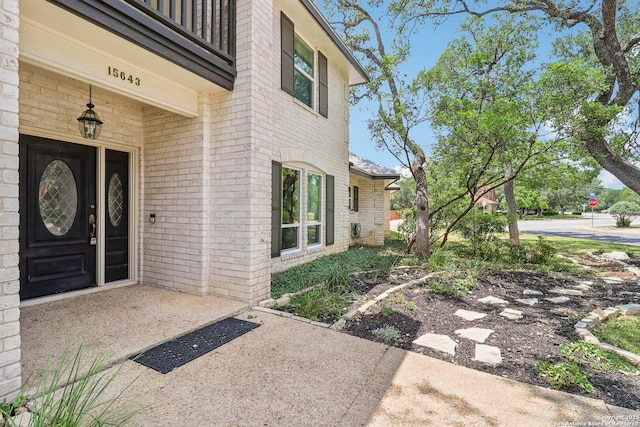 15643 Cloud Top, San Antonio, TX 78248 - doorway to property featuring brick siding