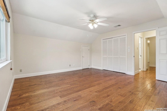 15643 Cloud Top, San Antonio, TX 78248 - unfurnished bedroom with wood finished floors, lofted ceiling, a closet, baseboards, and a ceiling fan