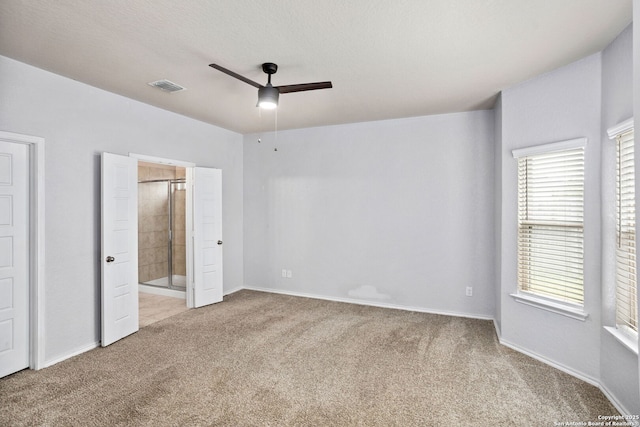 148 Whitetail, San Antonio, TX 78253 - unfurnished bedroom featuring light colored carpet, multiple windows, baseboards, and connected bathroom