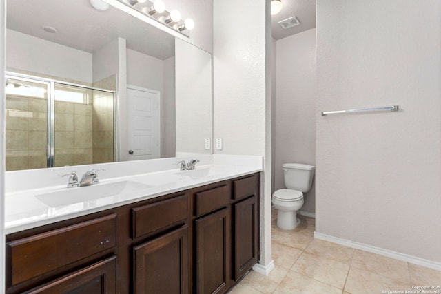 148 Whitetail, San Antonio, TX 78253 - bathroom featuring toilet, double vanity, a stall shower, tile patterned flooring, and baseboards