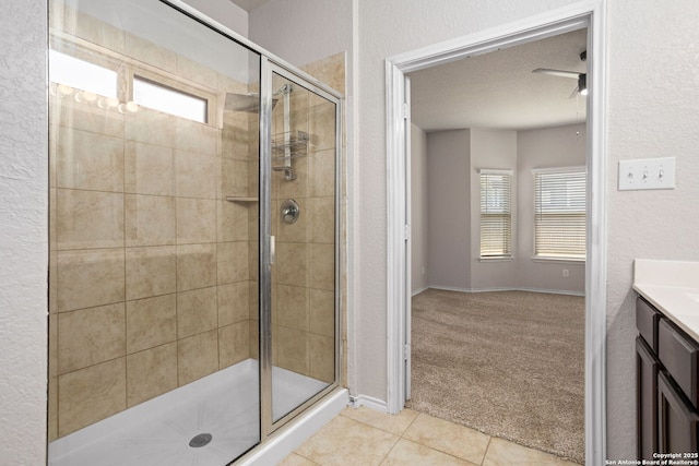 148 Whitetail, San Antonio, TX 78253 - bathroom featuring a shower stall, vanity, tile patterned floors, and baseboards
