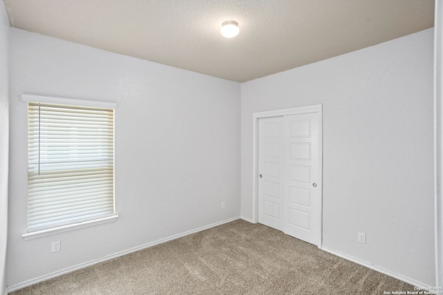 148 Whitetail, San Antonio, TX 78253 - unfurnished bedroom featuring carpet, a closet, and baseboards