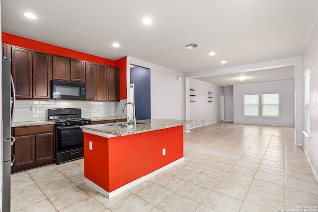 148 Whitetail, San Antonio, TX 78253 - kitchen featuring black appliances, a sink, tasteful backsplash, a kitchen island with sink, and open floor plan