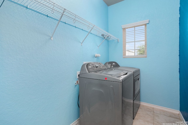 148 Whitetail, San Antonio, TX 78253 - laundry area with separate washer and dryer, baseboards, and light tile patterned floors