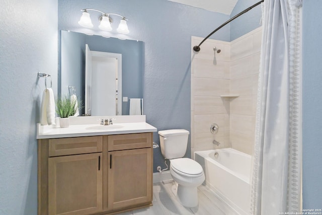 146 Beaver Bnd, Boerne, TX 78006 - bathroom with toilet, vanity, shower / bath combo with shower curtain, a textured wall, and baseboards