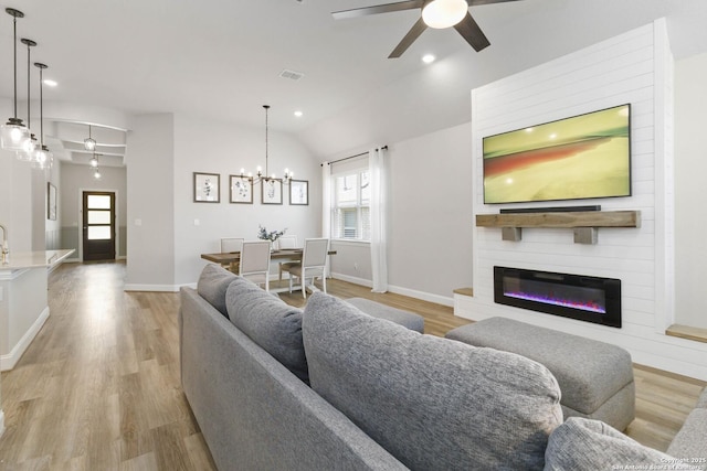 146 Beaver Bnd, Boerne, TX 78006 - living room featuring ceiling fan, a chandelier, light wood-type flooring, healthy amount of natural light, and recessed lighting