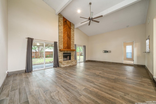 3202 Morning Crk, San Antonio, TX 78247 - unfurnished living room with high vaulted ceiling, a ceiling fan, wood finished floors, a fireplace, and beamed ceiling