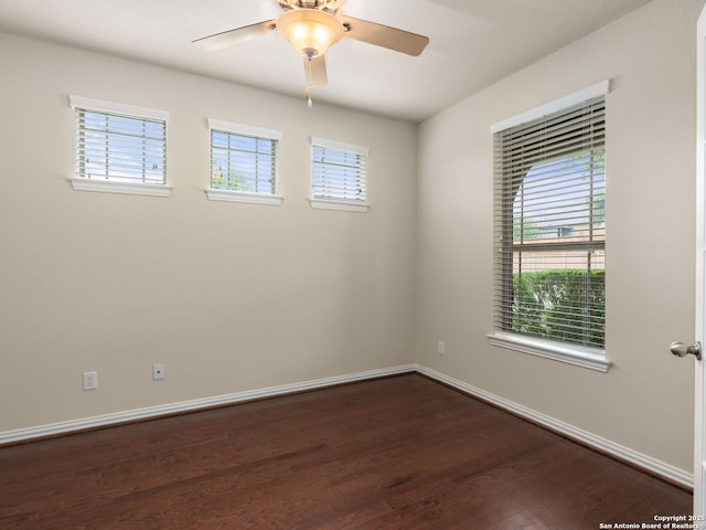 515 Secluded Grv, San Antonio, TX 78253 - empty room with healthy amount of natural light, dark wood-style floors, baseboards, and ceiling fan