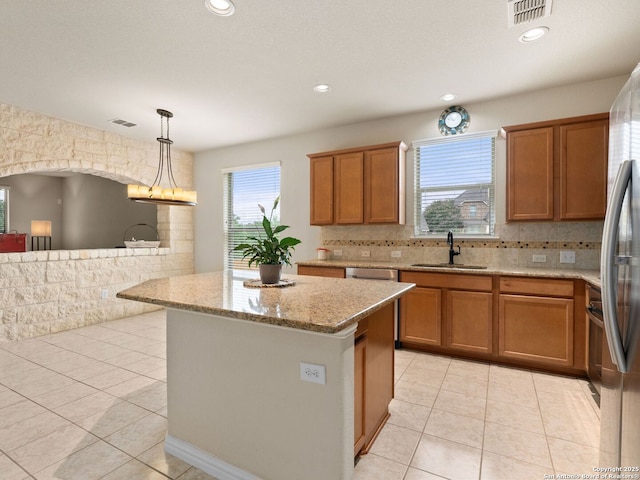 515 Secluded Grv, San Antonio, TX 78253 - kitchen with a sink, brown cabinets, light tile patterned flooring, and recessed lighting