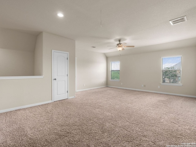 515 Secluded Grv, San Antonio, TX 78253 - unfurnished room featuring carpet flooring, ceiling fan, baseboards, a textured ceiling, and attic access