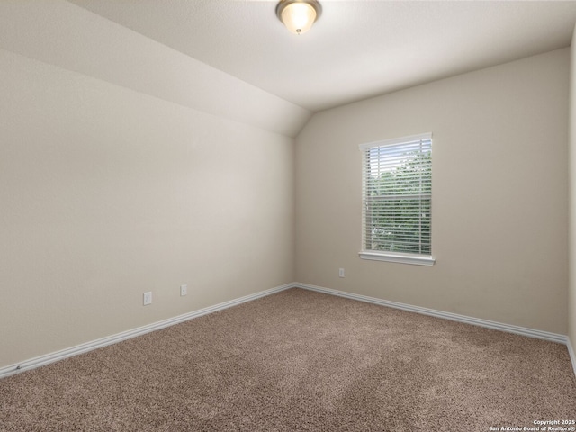 515 Secluded Grv, San Antonio, TX 78253 - spare room featuring carpet, vaulted ceiling, and baseboards
