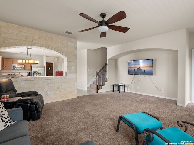 515 Secluded Grv, San Antonio, TX 78253 - living room with stairway, light carpet, ceiling fan, and baseboards